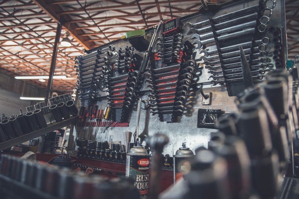 Organized wall of wrenches and hand tools in the shop
